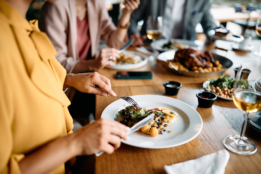 A party of people having a meal at a restaurant.